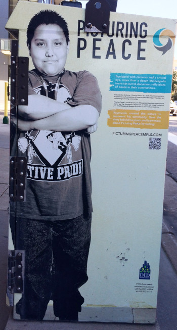 Standing on the corner, suitcase in my hand.